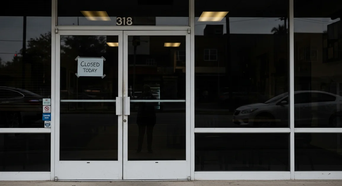 Closed Houston restaurant storefront after a power outage with 'closed due to power outage' handwritten sign and dim interior visible through dark windows.
